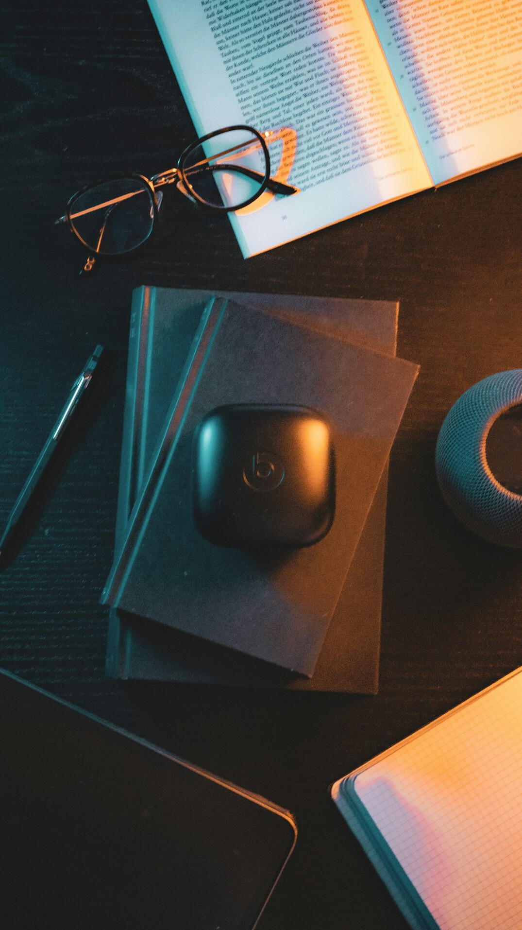 Laptop and printed documents with charts on a desk