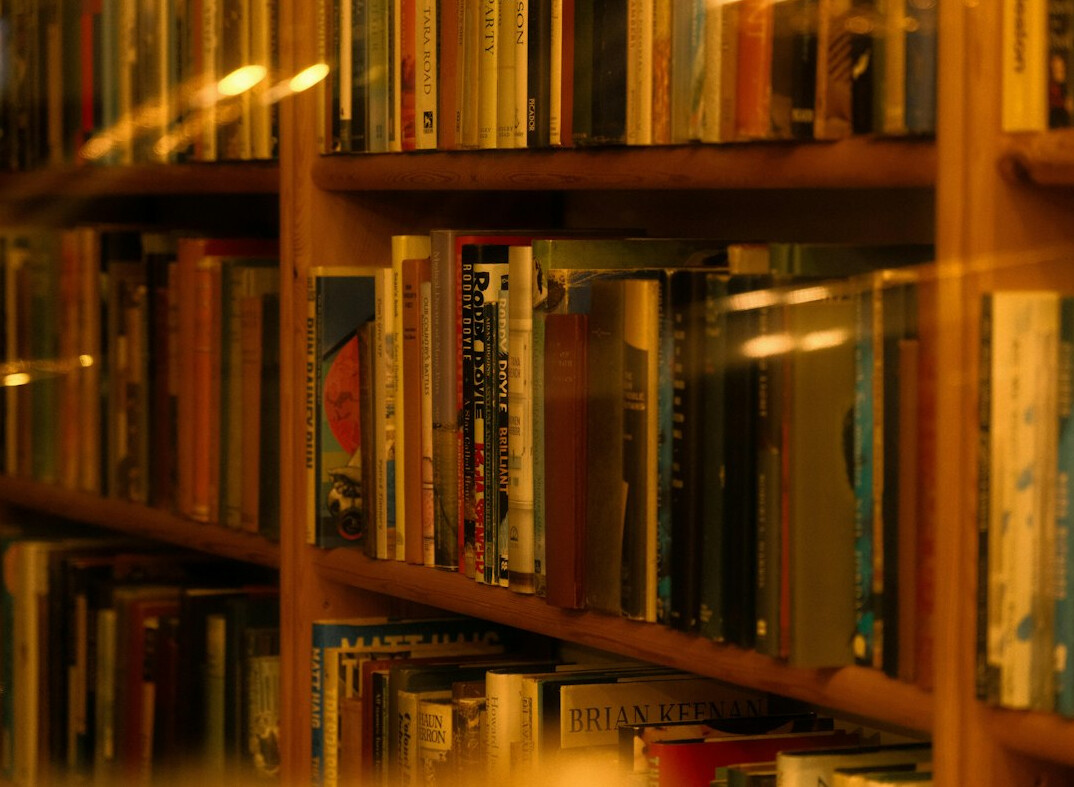 Bookshelves in a quiet library with warm light