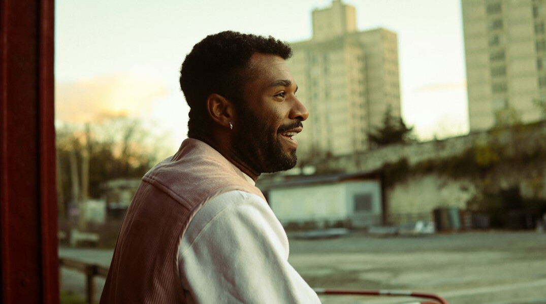 Portrait of a bearded man smiling outdoors